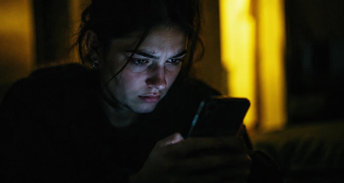 Artist checking a feature booking message and written agreement before payment